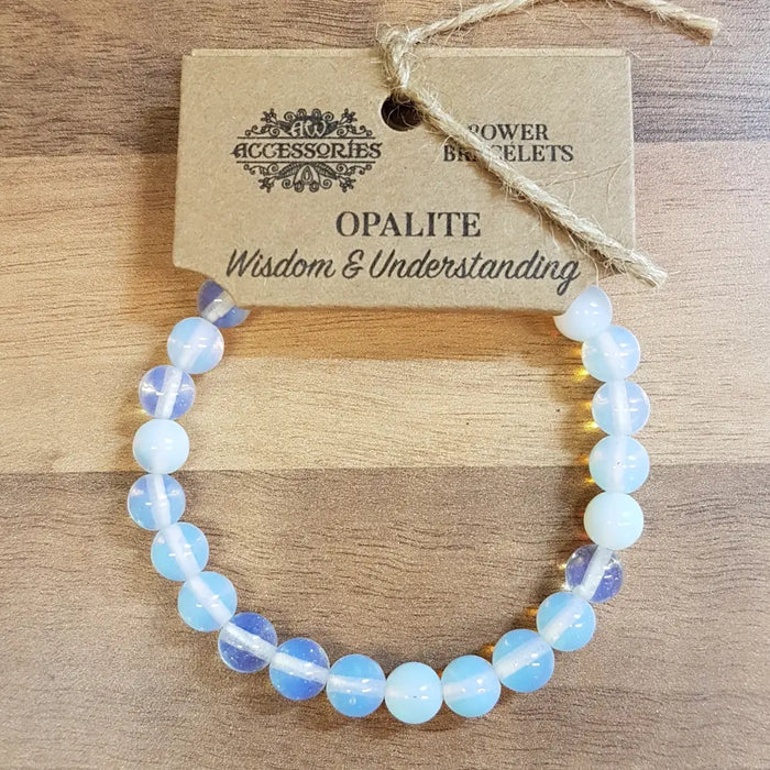 Opalite gemstone bracelet with smooth round beads in soft blue and white hues for mood and stone energy benefits