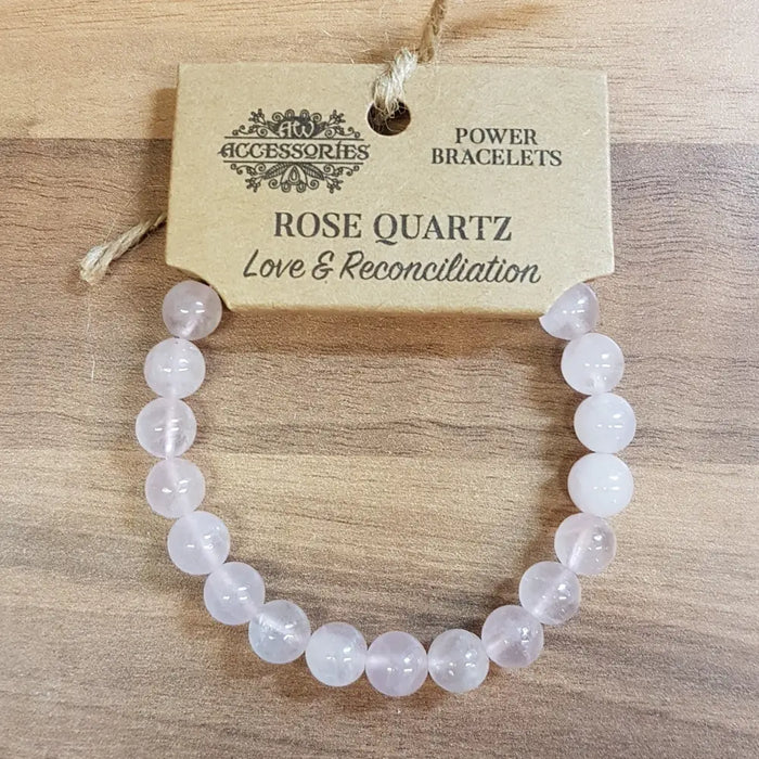 A delicate pink rose quartz gemstone bracelet made of smooth beads for mood support in gemstone power bracelets collection