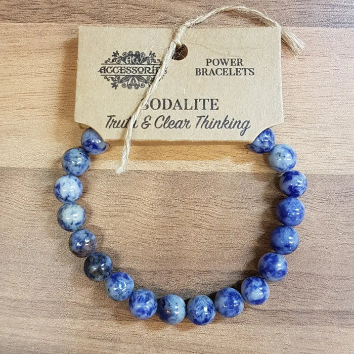 A blue sodalite gemstone bead bracelet with natural stone pattern shown on its branded tag for mood support