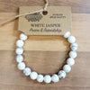 White jasper gemstone power bracelet with smooth round beads and natural gray veining for mood balance