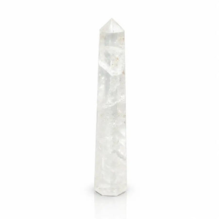 A clear quartz gemstone six face obelisk tower with faceted pointed top and octagonal base for meditation spaces