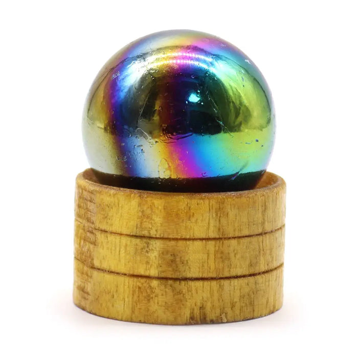 A glossy amethyst aura gemstone sphere with swirling rainbow hues on a stacked wooden base measuring 40mm