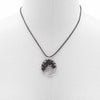Black agate gemstone tree of life pendant made of black resin on a black cord necklace