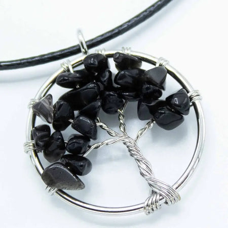 Silver wire wrapped gemstone tree of life pendant with black agate tumbled stones on a chain necklace