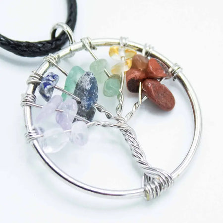 Silver wire-wrapped gemstone tree of life pendant with seven polished chakra stones in natural colors