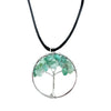 A silver wire-wrapped gemstone tree life pendant with green jade aventurine chips on a black cord necklace