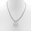 Silver wire-wrapped gemstone tree of life pendant with rock crystal stone on a black cord