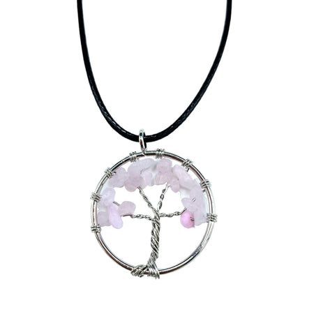 A gemstone tree of life pendant with silver wire and rose quartz chips on a black cord