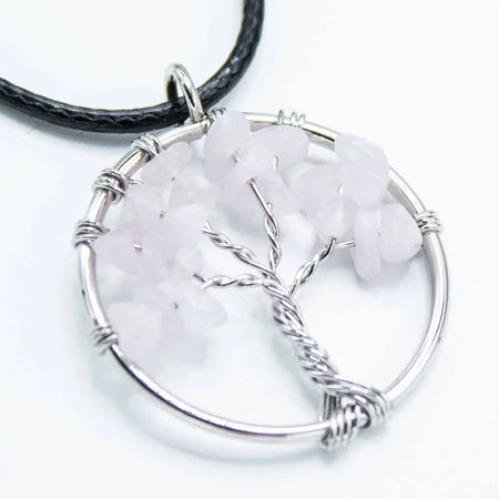 Silver wire-wrapped gemstone tree of life pendant with rose quartz chips on a black leather cord