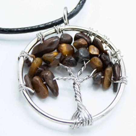 Silver wire-wrapped gemstone tree of life pendant with polished tiger eye stones in warm brown and golden hues