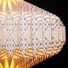 Geometric origami light shade with gray white and gold triangular and diamond paper lantern design and warm glow interior