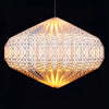 Geometric origami paper pendant light shade in warm yellow with patterned design and soft illumination