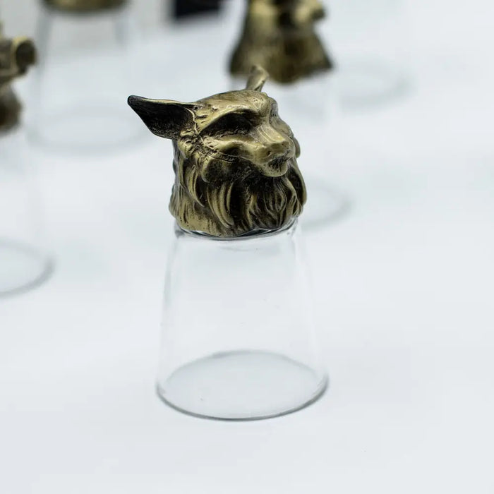 Antique bronze shot glass with a brass fox head featuring detailed fur and a clear inverted stem from mystical creatures set