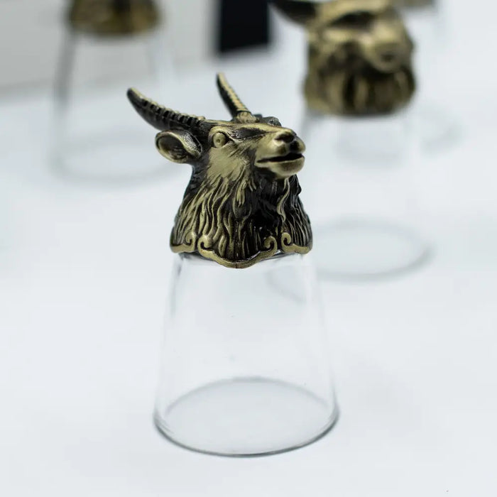 Antique bronze shot glass with clear glass and brass goat head stopper from forest and mystical creatures set