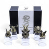 Set of six antique bronze shot glasses with mystical creatures and clear glass bases for drinking spirits