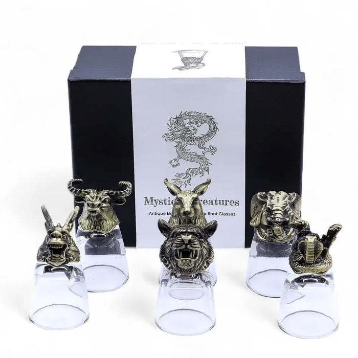 Set of six antique bronze shot glasses with mystical creatures and clear glass bases for drinking spirits