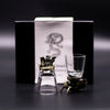 A clear glass shot glass with a golden dragon stopper and an elephant base from mystical creatures shot glasses set