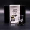 A clear glass shot glass with a golden rabbit stopper and base from mystical creatures shot glasses gift set