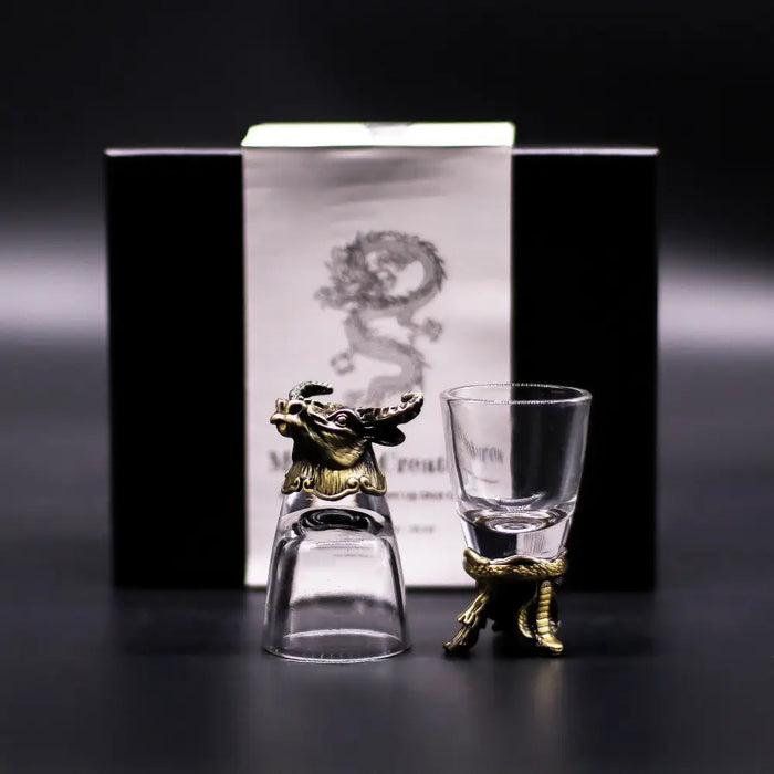 Gift set of 6 bottom up shot glasses with clear glass bodies and brass colored golden dragon mystical creatures accents