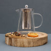 Clear glass infuser teapot tower shape with stainless steel filter lid and sleek handle in a 750ml capacity