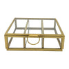 Gold-toned glass jewellery box with minimalist design and circular handle for stylish tabletop decor