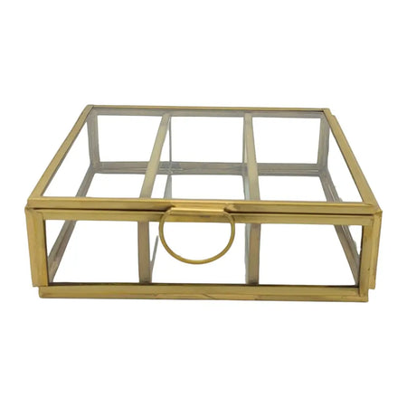 Gold-toned glass jewellery box with minimalist design and circular handle for stylish tabletop decor