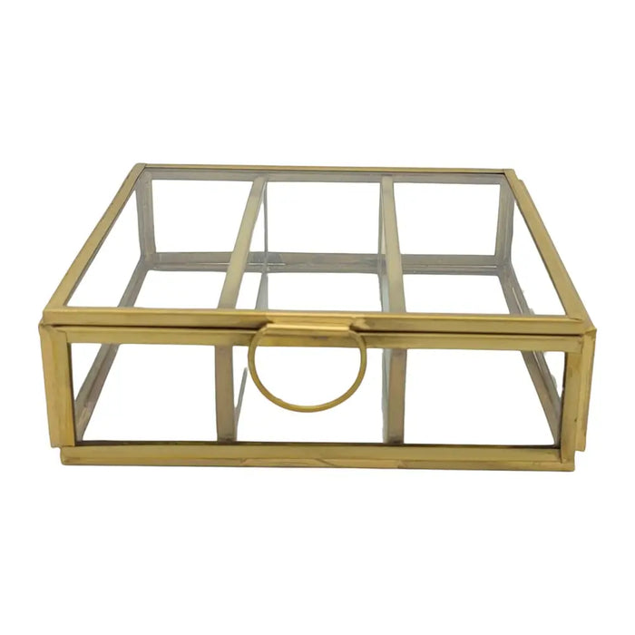 Gold-toned glass jewellery box with minimalist design and circular handle for stylish tabletop decor