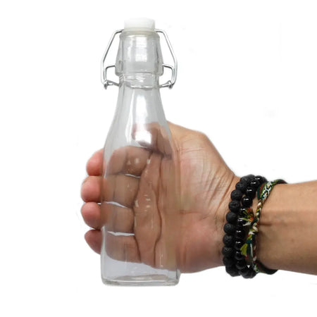Clear glass kilner storage bottle 250ml with silver metal swing-top closure and white plastic stopper
