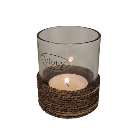 Glass votive and tealight holder with brown string trim featuring a transparent glass candle holder and lit tea light