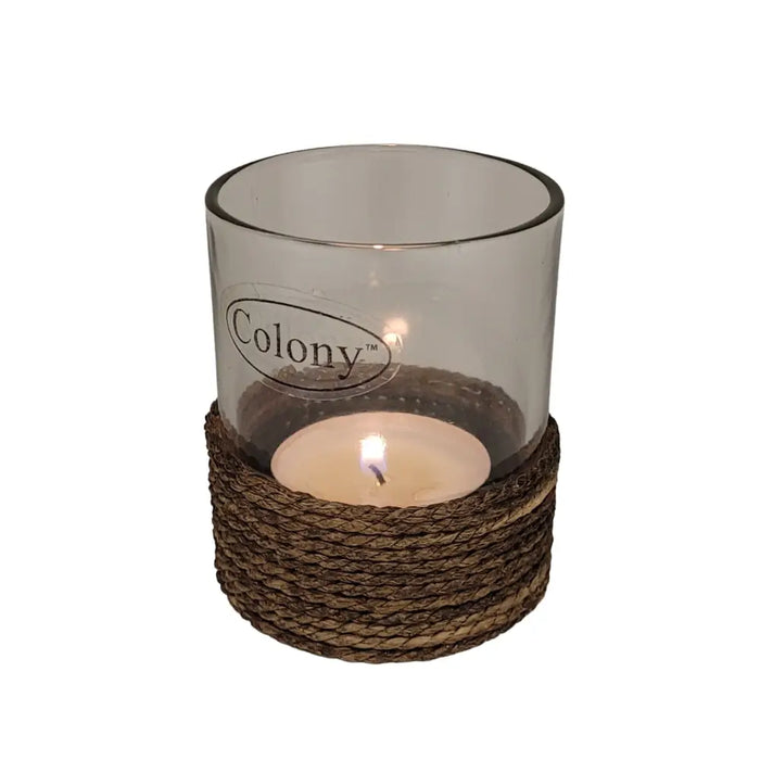Glass votive and tealight holder with brown string trim featuring a transparent glass candle holder and lit tea light