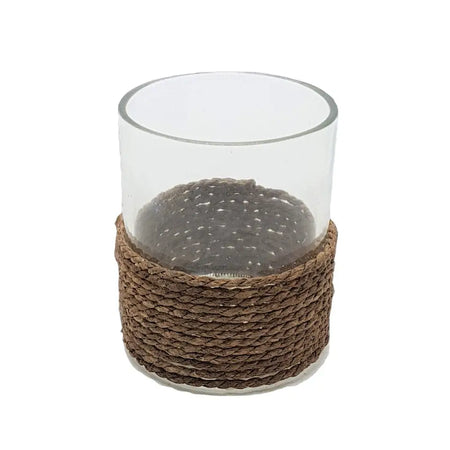 Clear glass votive and tealight holder with a woven brown string base for candle display or decor