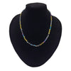 A gold finish beaded necklace with square rainbow hematite glass beads in gold silver blue and purple shades