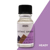 A clear glass bottle with black cap labeled ancient wisdom gothic dream fragrance oil with purple brown geometric design