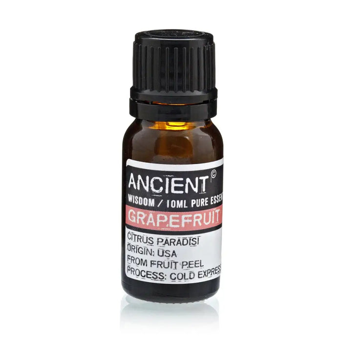 A small amber glass bottle of ancient wisdom grapefruit essential oil with a black ribbed cap and pink label stripe