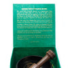 Green tara singing bowl set 10cm in a green velvet-lined box with wooden mallet resting beside the bowl