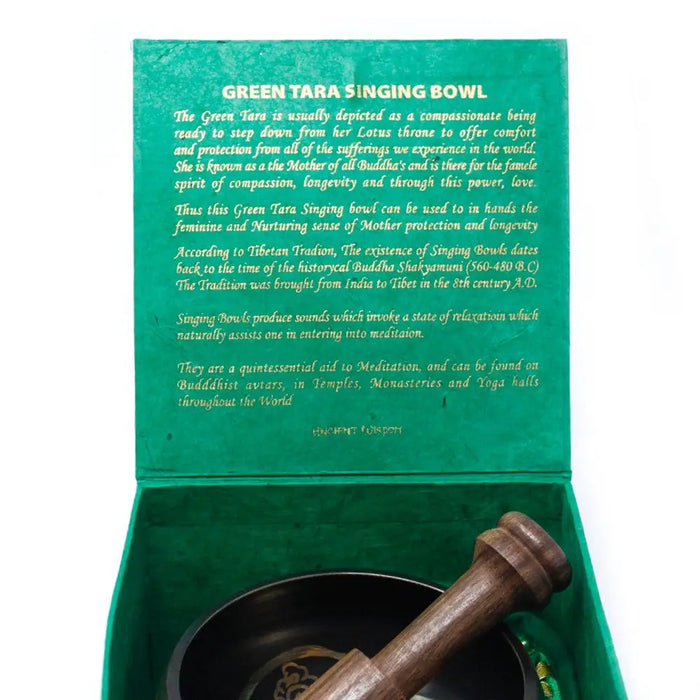 Green tara singing bowl set 10cm in a green velvet-lined box with wooden mallet resting beside the bowl