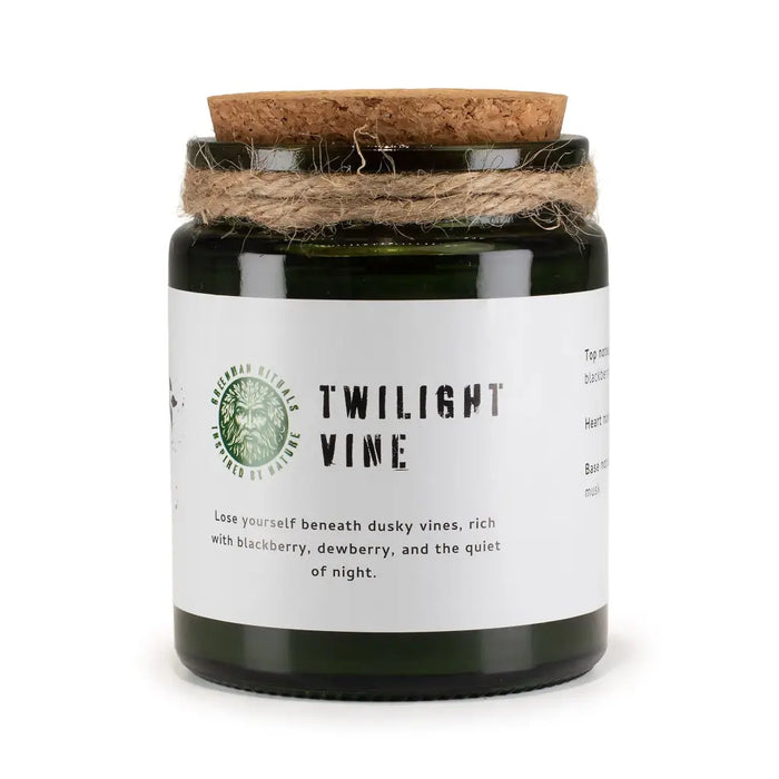 Dark green glass woodwick soy candle with cork lid and twine labeled twilight vine by greenman rituals