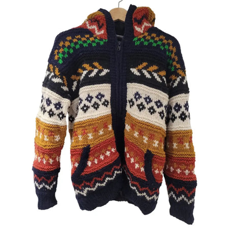 A fair trade 100% wool knitted jacket with fleece lining in navy blue cream orange red and green geometric pattern