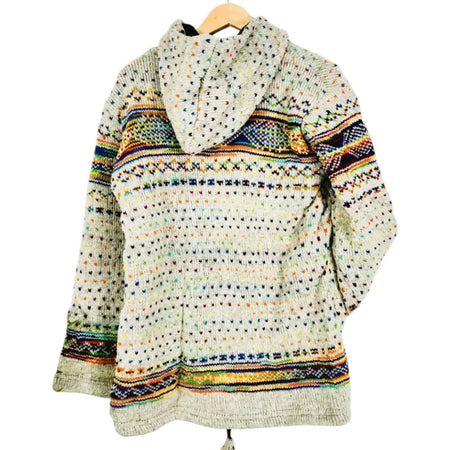 A cozy off-white wool knitted hoodie sweater with vibrant rainbow speckled geometric stripes and dots by gringo fairtrade
