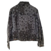 A dark gray denim gringo fairtrade jacket with a distressed star print and faded worn textures
