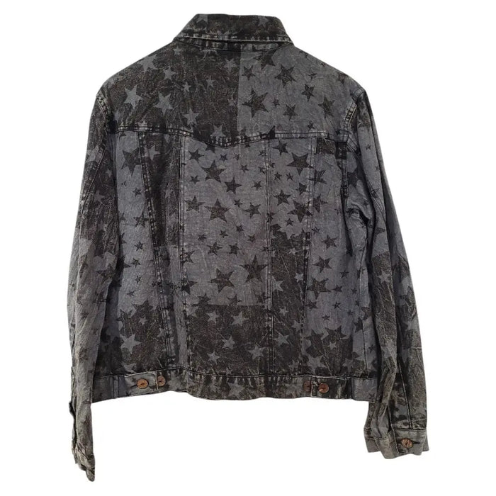 A dark gray denim gringo fairtrade jacket with a distressed star print and faded worn textures