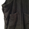 Black corduroy sleeveless vest with vertical ribs and pockets paired with gringo fairtrade jumbo cord dungarees black