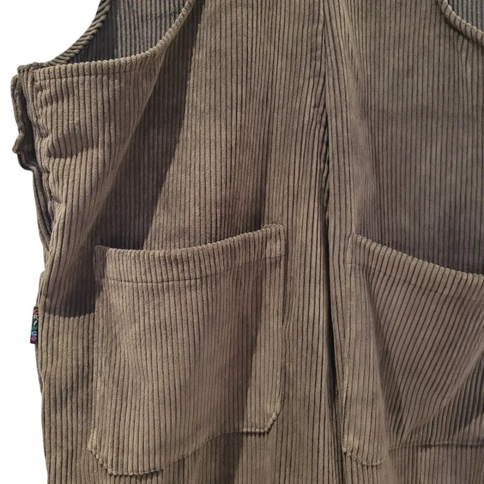Brown corduroy sleeveless vest with ribbed texture and front pockets paired with chocolate jumbo cord dungarees with two buttons