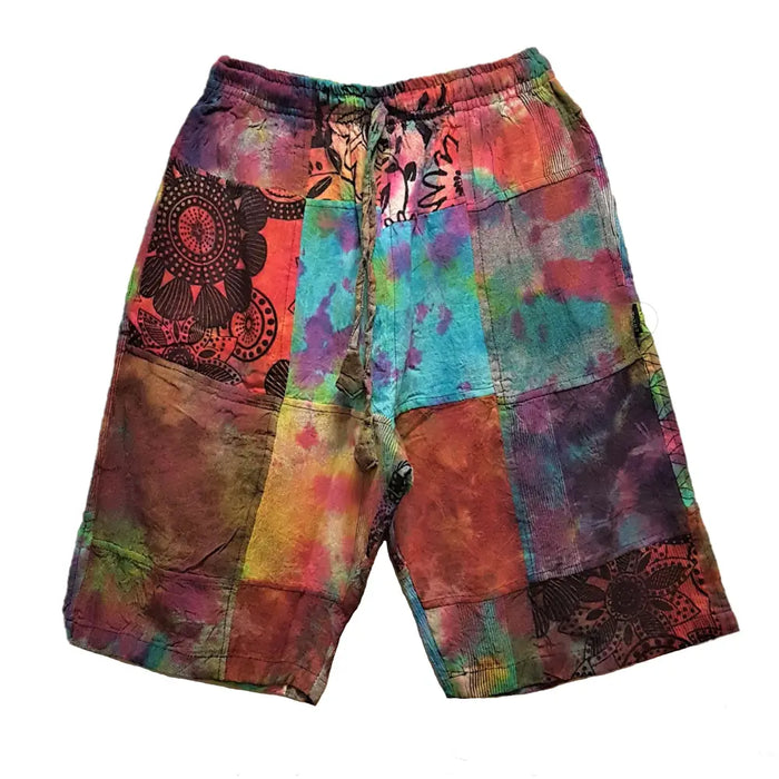 Vibrant gringo fairtrade patchwork tie-dye shorts in multicolored floral pattern made from textured fabric with elastic waist