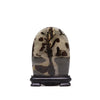 A polished guohua picture agate stone with manganese dendrites in dark brown and gray on a black wooden stand