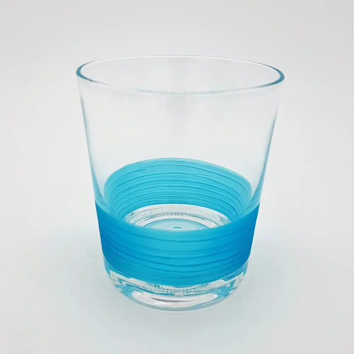 Clear glass votive with a vibrant blue ribbed band near the base used as a tealight holder in four colour options