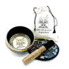 Hand-beaten engraved singing bowl gift with black exterior gold lotus flower interior and greek key border design