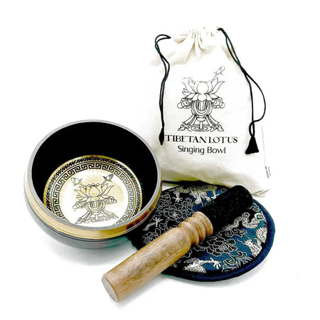 Hand-beaten engraved singing bowl gift with black exterior gold lotus flower interior and greek key border design