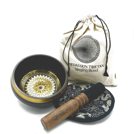 Black hand-beaten engraved singing bowl with gold geometric inlay wooden mallet and cloth in a bowl gift set