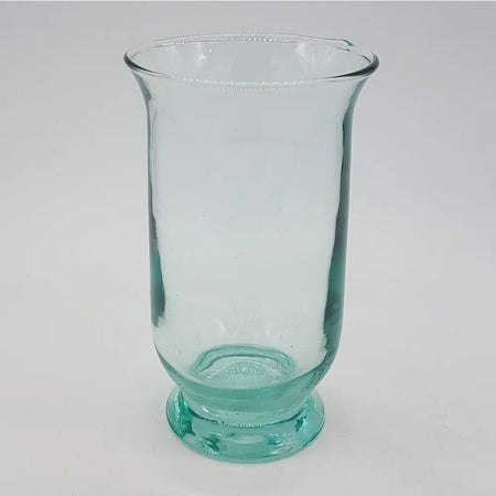 A hand-blown recycled glass vase in translucent teal with a flared rim and textured rounded base for use as a hurricane lamp